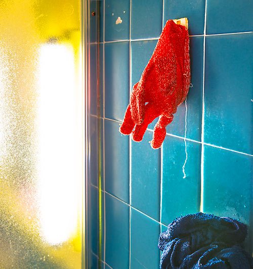 Red Glove, Blue Bathroom Tiles
