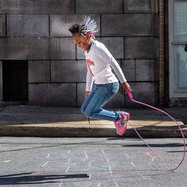 girl jumping rope on North Shipley Street in Wilmington, Delaware by Danny N. Schweers