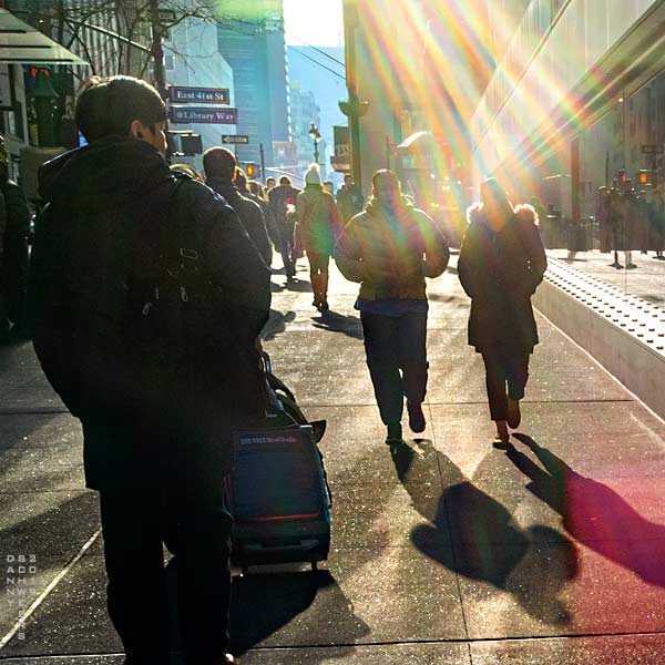 Photo of pedestrians and sunshine, East 41st Street and 6th Avenue, New York City by Danny N. Schweers, 2019