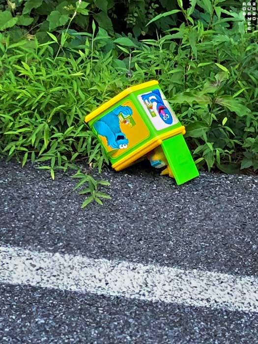 Lost or discarded jack-in-the-box toy along highway, photo by Rob Gurnee